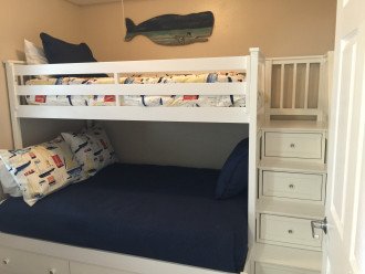 Third room has bunks with a full size mattress on bottom a single on top