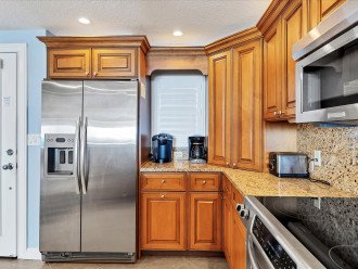 Stainless steel appliances, granite counters, 2 coffee makers & sparkling clean.