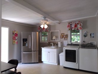 Laundry room with attached golf cart garage