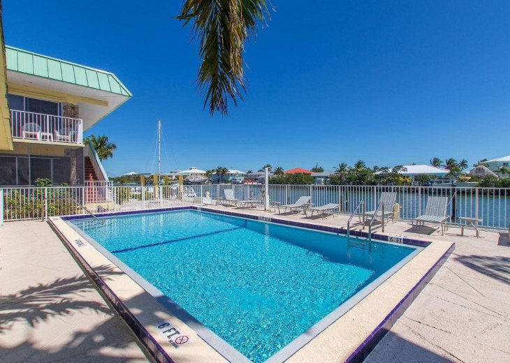 ***NEW Beautiful condo with boat dock, slip and heated pool #1