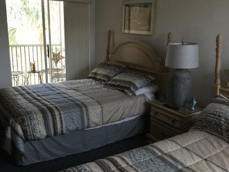 2nd bedroom with full bedroom and screen in porch