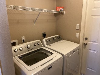 Inside Laundry with large Washer and Dryer