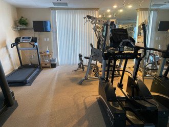 Condo Association Workout room with bathrooms and saunas