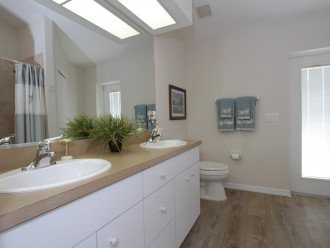 Guest bathroom opens to the lanai - straight from the pool into the shower!