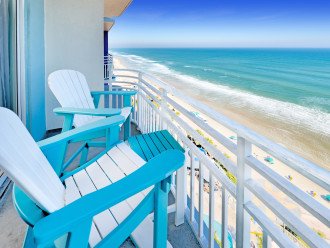 Oceanfront balcony with pub chairs