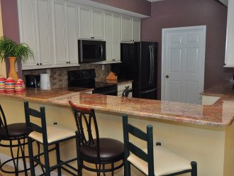 Fully equipped kitchen with newly updated granite countertops and cabinets