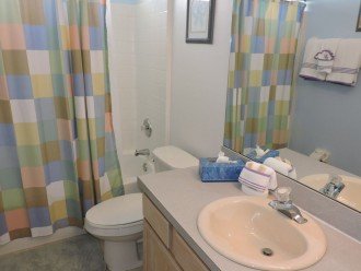 One of 3 bathrooms, this one with both bath and shower