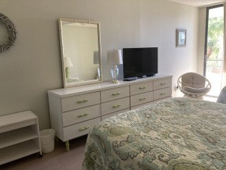 Guest bedroom with balcony access and walk in closet