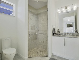3. Bathroom in guest suite with sink and shower