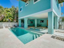 Salty Shamrock is 3 houses from the beach with private heated pool & spa