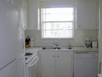 All white kitchen, microwave and additional counters not shown.