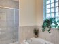 Master bathroom: walk- in shower and bath tub