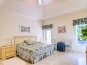 Master bedroom with King size bed and access to pool area
