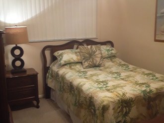 2nd bedroom with full size bed and a walk in closet