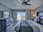 Master bedroom with balcony entrance, king size bed