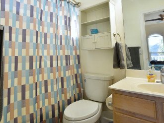 Attached master bath with tub and shower