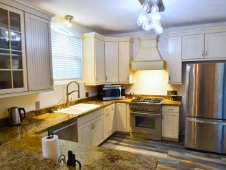 Gourmet kitchen with stainless appliances, gas range, and convection oven