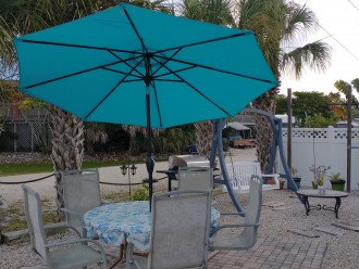 Social area to swing, grill or just relax under the umbrella.