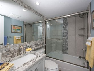 Modern, super clean front bathroom and multiple hair drayers