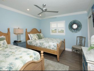 This is the second bedroom with a queen bed and a single bed