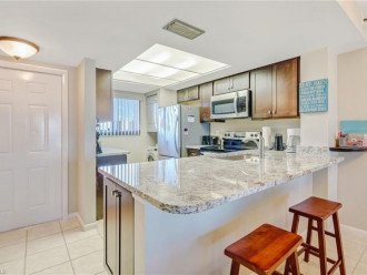 Gorgeous kitchen has granite counters, stainless appliances and is fully stocked