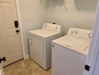 Laundry room with full-size washer and dryer.