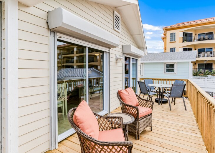 Relax on your private deck with cozy seating and dining space, perfect for morning coffee or evening gatherings under the open sky.