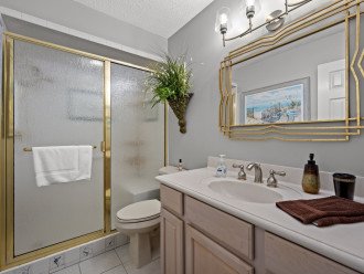 master bath with walk in shower and bench
