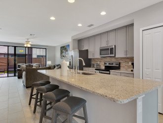 kitchen area with Bar Stools along island
