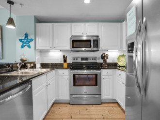 Upgraded kitchen with granite counter tops and stainless steel appliances