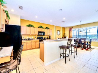 Beautiful open plan kitchen with views of the pool area