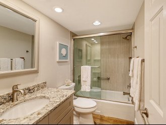 Remodeled guest bath with tub