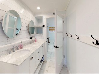 His and Her Sinks and Mirrors with Marble Counter Top