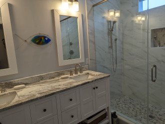 Bathroom with double sinks and huge shower