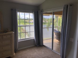 Owner's suite with lots of natural light with sliders to lanai