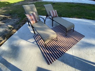 Rear deck finds another set of loungers that are more private than the pool deck