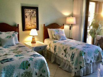 twin bedroom with shared lanai