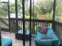 Screened Porch on Main Level Overlooking Pool and Courtyard