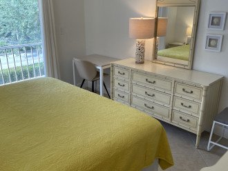 Primary bedroom with bathroom and walk in closet