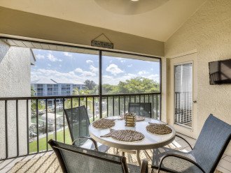 Patio of this Fort Myers townhouse with table and chairs.