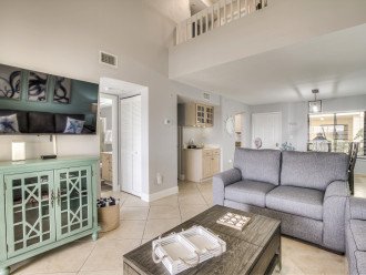 The living area of this Fort Myers Townhouse, with couches, modern TV, and coffee table.