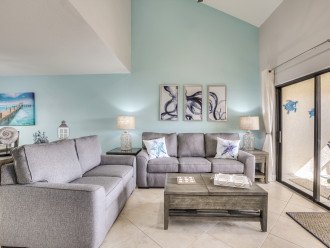 View of the living area of this Fort Myers townhouse, with two couches and a coffee table.