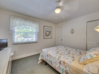 Bedroom with Small TV and Bed