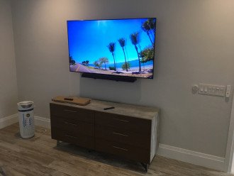 65 in TV with sound bar in Master Suite- bonus air purifier in Master