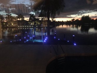 Dock w/ boat lift at night.