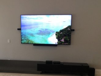 Awesome 85in with surround sound bar in great room.