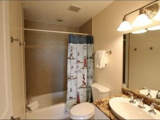 Ensuite Bathroom with Tub and Shower and Vanity with Storage