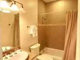 Well appointed bathroom with tub and shower