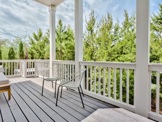 Plenty of seating to enjoy the tropical air and beautiful scenery with your favorite beverage - Main floor back patio that leads to the hot tub, grilling and outdoor dining area