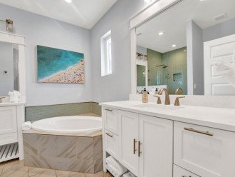 Primary bedroom bathroom suite with large soaking tub